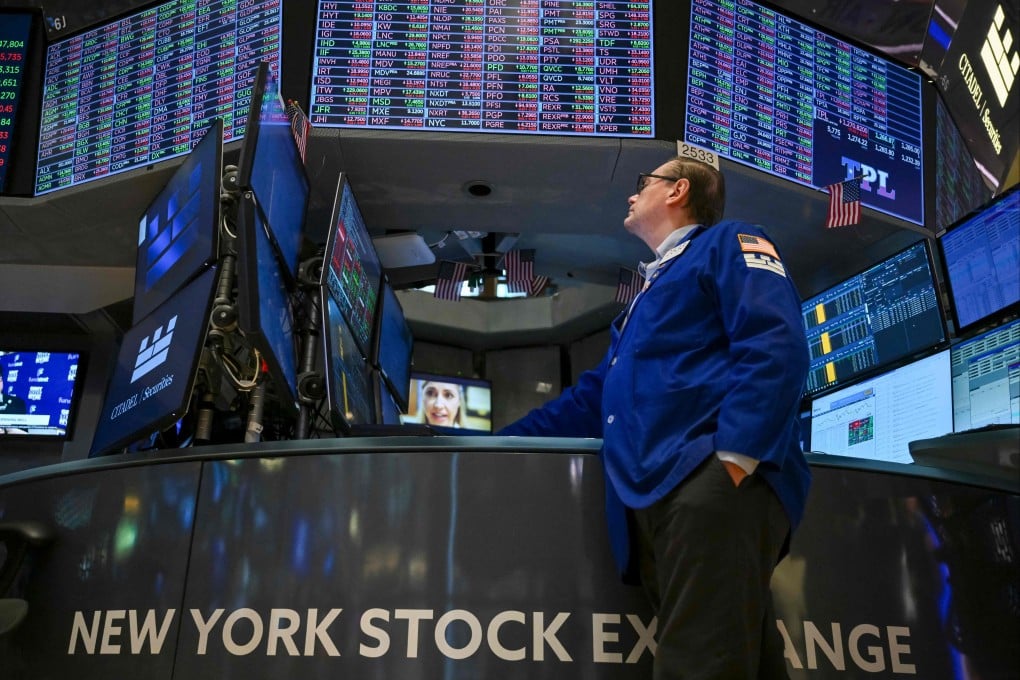 A trader at the New York Stock Exchange at the opening bell on April 21, as Wall Street stocks opened lower amid lingering uncertainty over US President Donald Trump’s trade policy. Photo: AFP