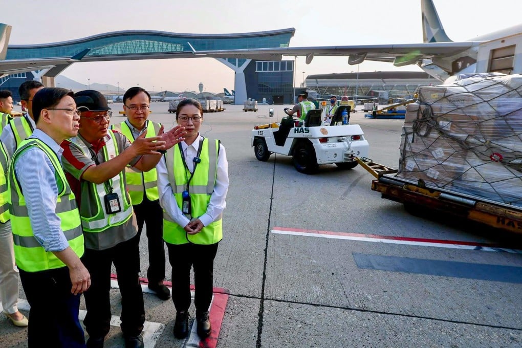 City leader John Lee visits frontline workers at Hong Kong International Airport. Photo: Handout