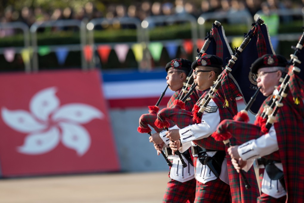 Bagpipe players from the Hong Kong Police Band play during a passing-out parade at Hong Kong Police College in Wong Chuk Hang in 2017. Photo: EPA