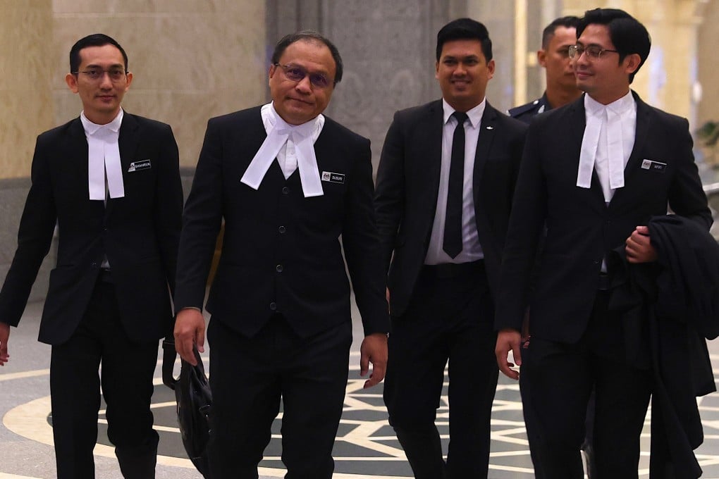 Malaysia attorney-general Mohd Dusuki Mokhtar (second left) and his team arrives to appeal against a royal addendum for jailed former prime minister Najib Razak at the Federal Court in Putrajaya, Malaysia on Monday. Photo: EPA-EFE