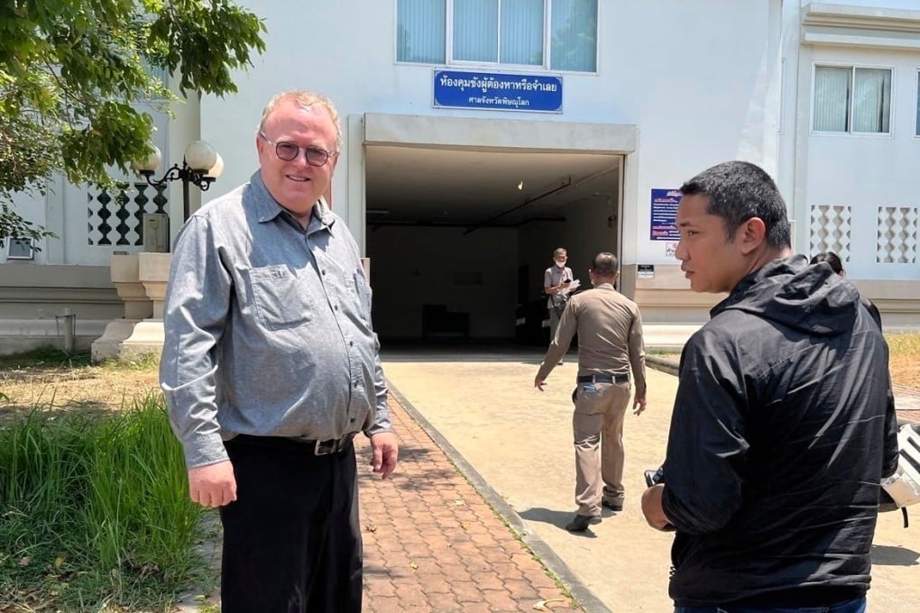 US political science lecturer Paul Chambers (left) of Thailand’s Naresuan University, stands outside the police station in Phitsanulok, Thailand, where he was arrested on April 8, 2025, on charges of insulting the monarchy. Photo: AP