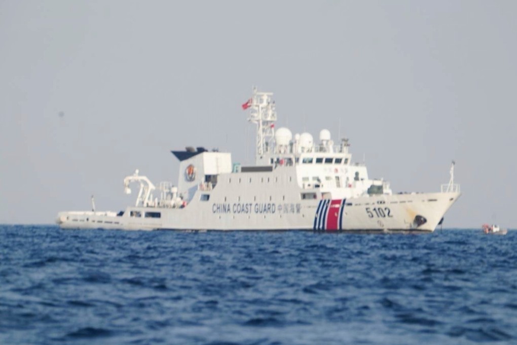 A Chinese coastguard ship patrols the area as Philippine inter-agency members visit Sandy Cay in the South China Sea on April 27. Photo: National Task Force West Philippine Sea/AP