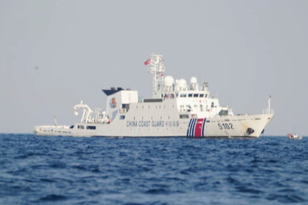A Chinese coastguard ship patrols the area as Philippine inter-agency members visit Sandy Cay in the South China Sea on April 27. Photo: National Task Force West Philippine Sea/AP