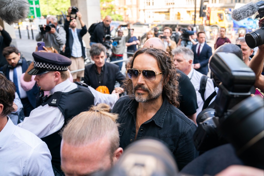 Russell Brand arrives at Westminster Magistrates’ Court on Friday. He currently lives in Florida but is obliged to attend all future court appearances. If he does not, he will face prison. Photo: dpa