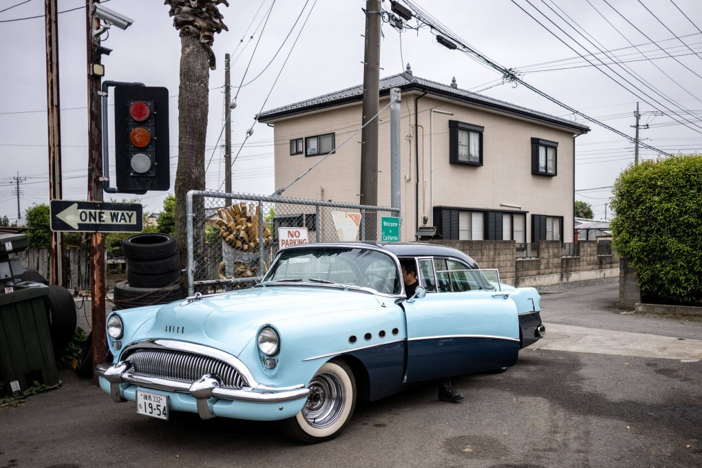US car dealer Yosuke Fukuda drives a 1954 Buick Roadmaster in Fukaya, Japan’s Saitama prefecture. Photo: AFP