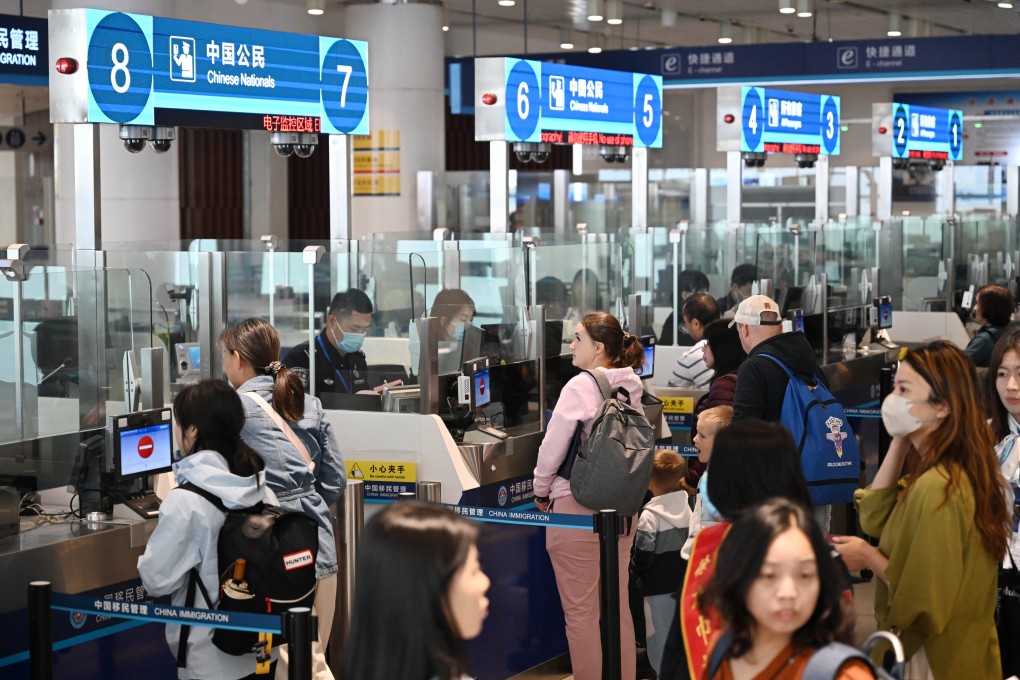 Tourists line up to pass through passenger clearance procedures at Tianjin International Cruise Home Port in Tianjin on Thursday. Photo: Xinhua