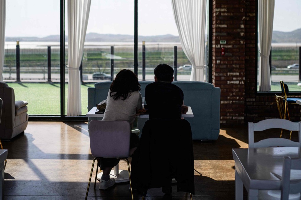 Customers at Daonsoop cafe look towards North Korea less than 2km away. The owners built the cafe close to the border to be close to their ancestral home. Photo: AFP