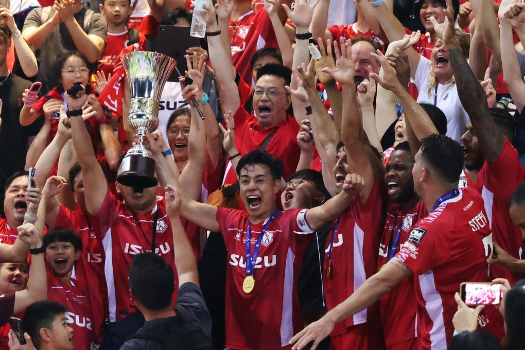 Shu Sasaki clutches the Sapling Cup as he orchestrates jubilant post-match celebrations. Photo: Nora Tam