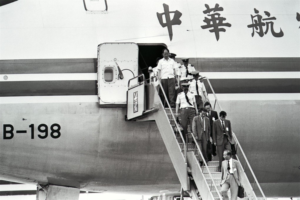 Taiwan China Airlines crewmen descending from their plane after landing at Kai Tak Airport in Hong Kong following their unplanned trip to mainland China. Photo: SCMP Archives