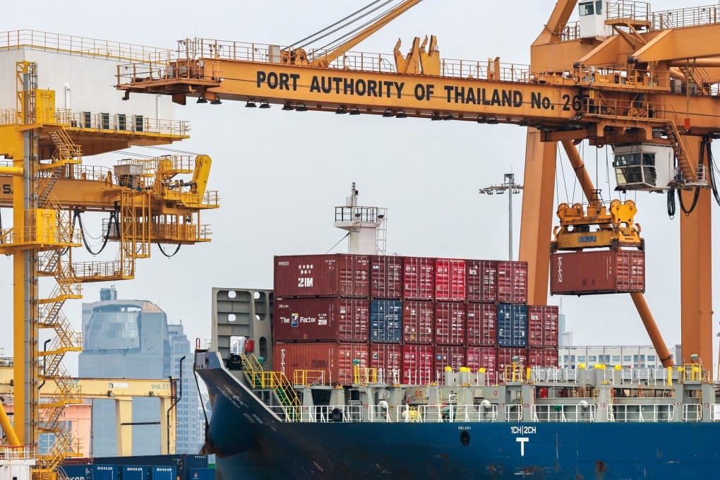 Cargo ships are loaded with containers at a port in Thailand last month. Photo: Reuters