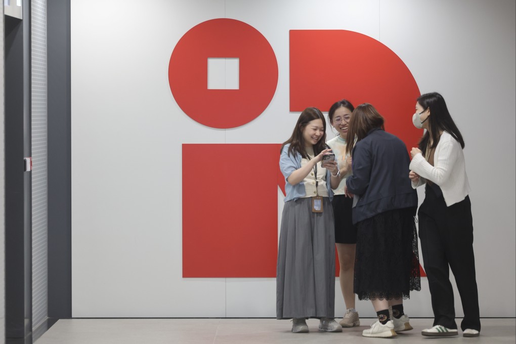A group of office workers gather at the Inland Revenue Centre in Kai Tak. Photo: Edmond So