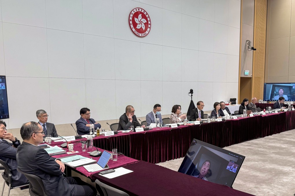 Members of the Task Group on New Medical School learn more about the competing universities’ proposals. Photo: Handout