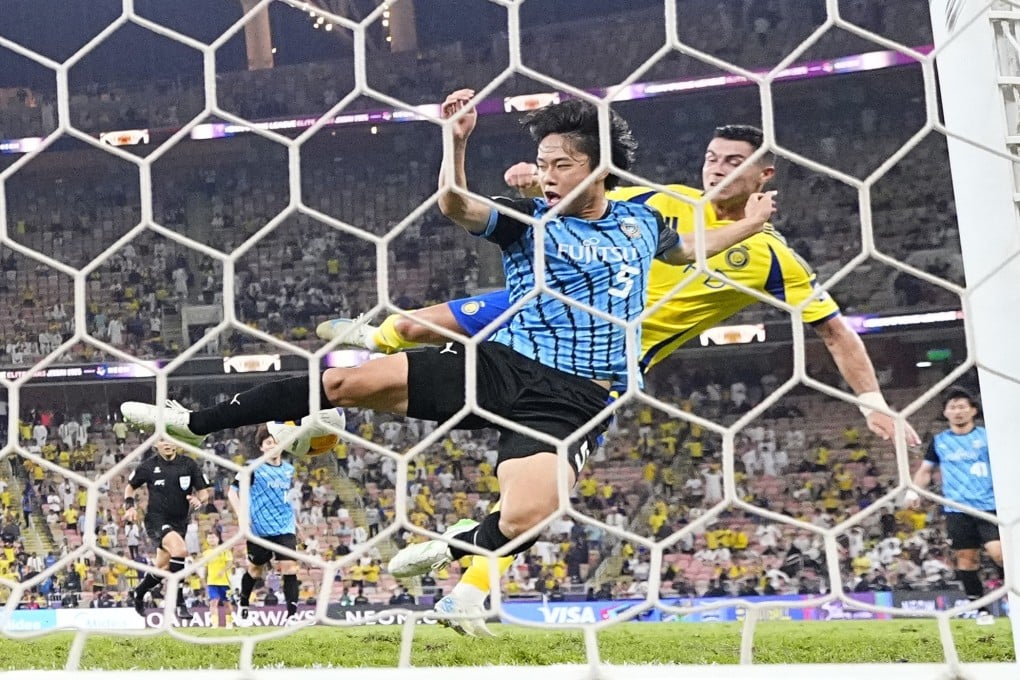 Asahi Sasaki of Kawasaki Frontale blocks a shot by Cristiano Ronaldo of Al-Nassr just before the final whistle of their Champions League Elite semi-final. Photo: Kyodo