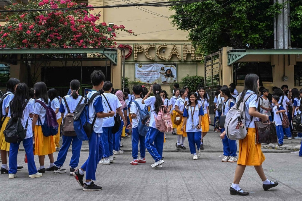 Filipino students waiting for their classes outside a high school in  Manila. Photo: AFP