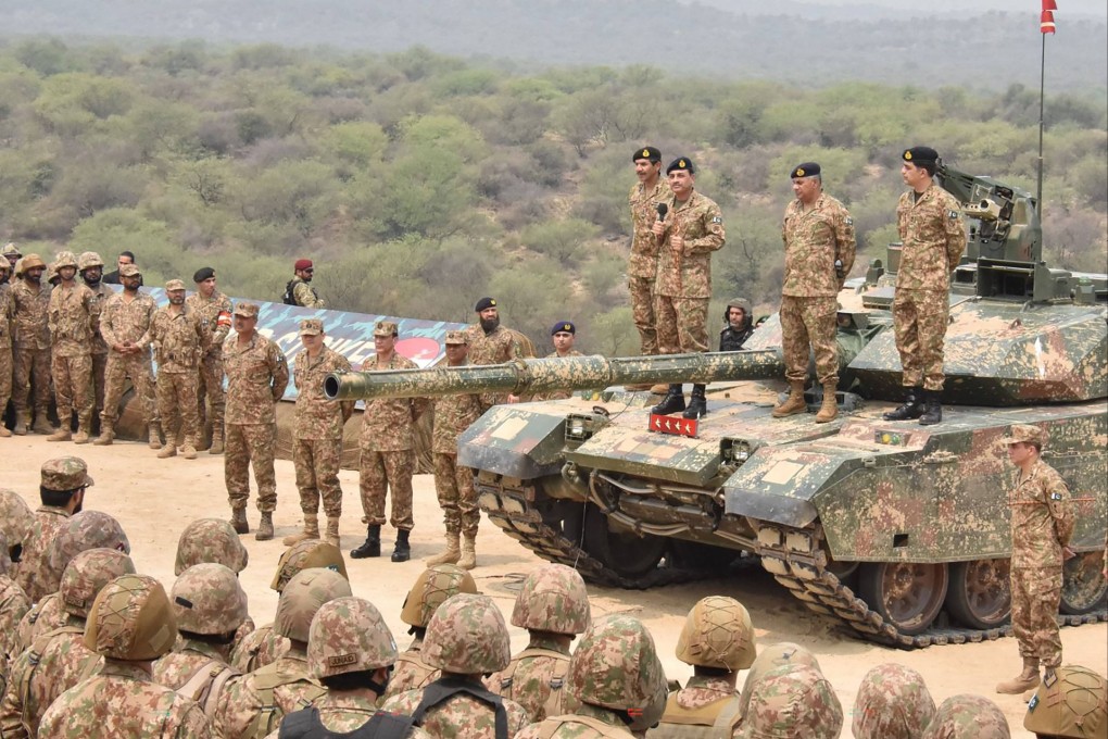 Pakistan army officers stand on tanks during a training exercise in Punjab province on Thursday. Photo: AFP