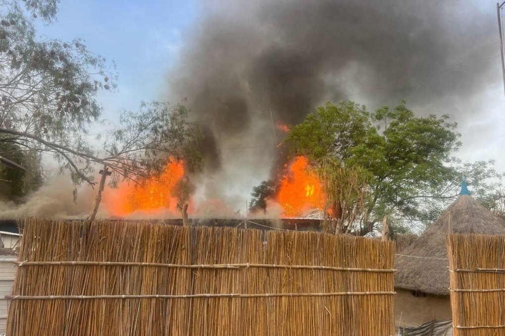Fire burns following an aerial bombardment that resulted in deaths at the medical charity Medecins Sans Frontieres facility in South Sudan on Saturday. Photo: Handout via Reuters