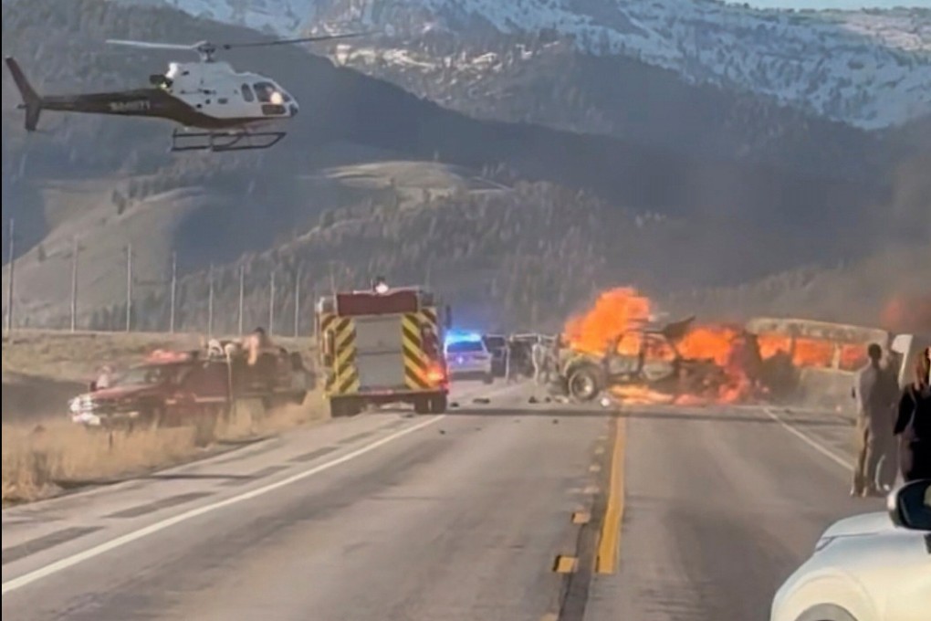 Rescue workers at the scene of a fatal collision between a pickup truck and tour van carrying foreign tourists in Idaho. Photo: Roger Merrill via AP