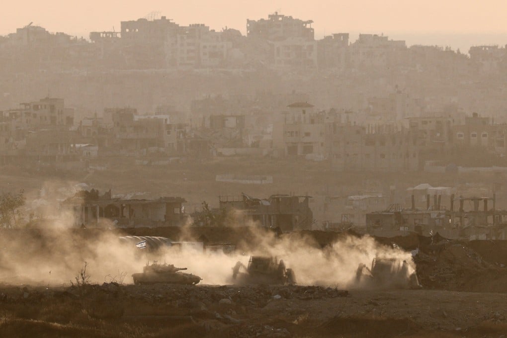 Israeli military vehicles operate in Gaza on Saturday. Photo: Reuters