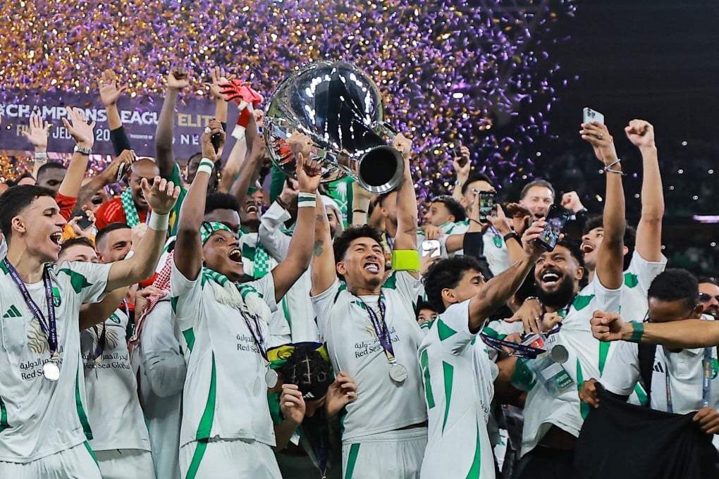 Al-Ahli’s Roberto Firmino lifts the trophy as he celebrates with teammates after winning the Asian Champions League. Photo: Reuters