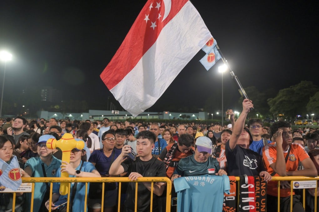 Supporters of the opposition Workers’ Party listening to a speech on Saturday night as preliminary results trickled in. Photo: EPA-EFE