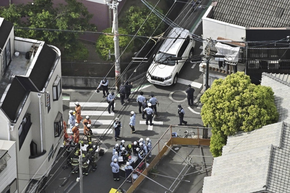 Police officers inspect the scene of the attack in Osaka, western Japan, on Thursday. Photo: Kyodo News via AP