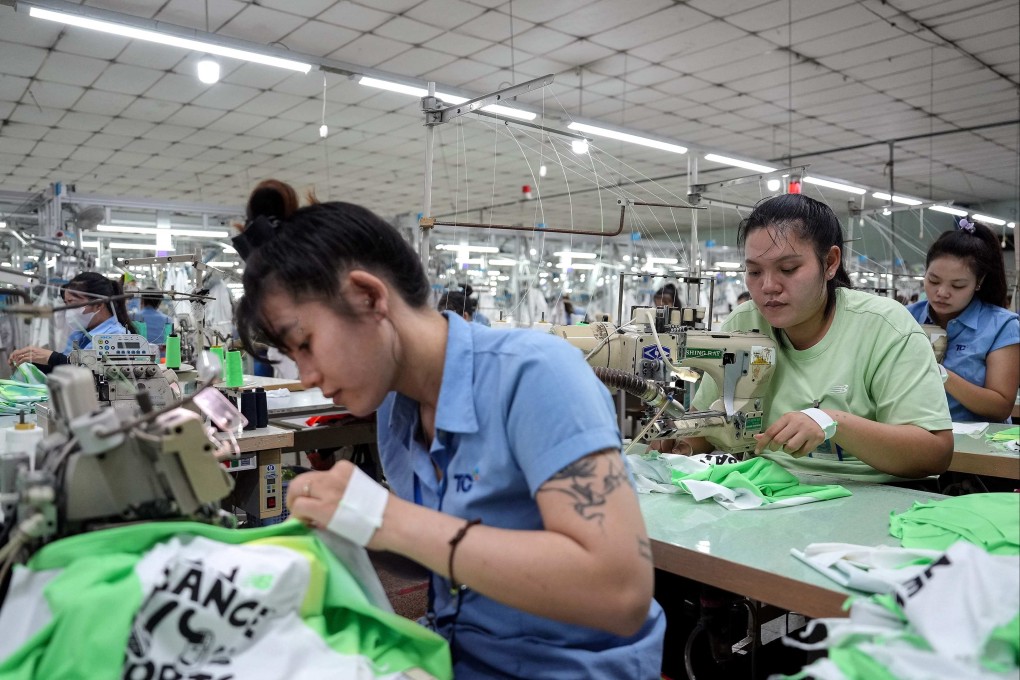 Vietnamese garment factory workers stitch apparel at a factory in Ho Chi Minh City on April 3. Photo: AFP