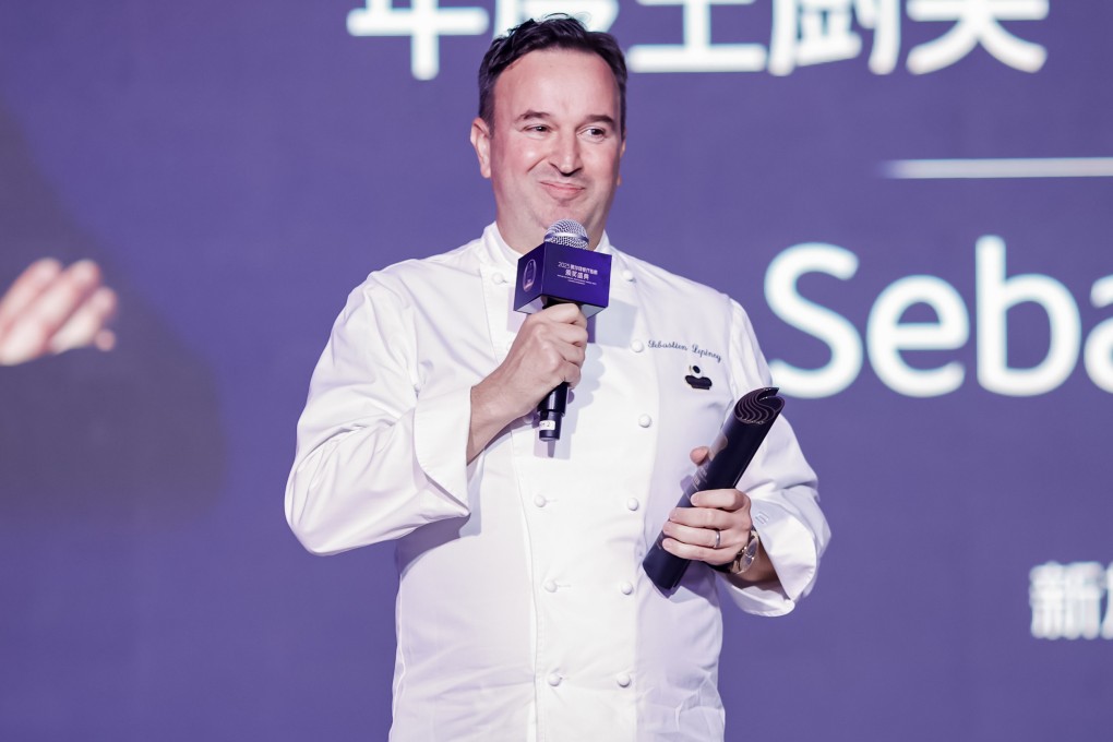 Sebastien Lepinoy of Singapore’s Les Amis restaurant, recipient of the Black Pearl Restaurant Guide 2025’s Master Chef Award, speaks on stage at the awards ceremony in Singapore. Photo: Meituan