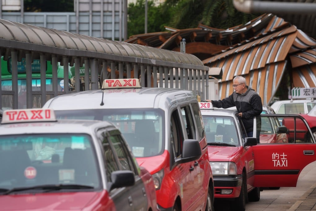 A driver waits for customers at a taxi stop in Mong Kok. Photo: Elson Li