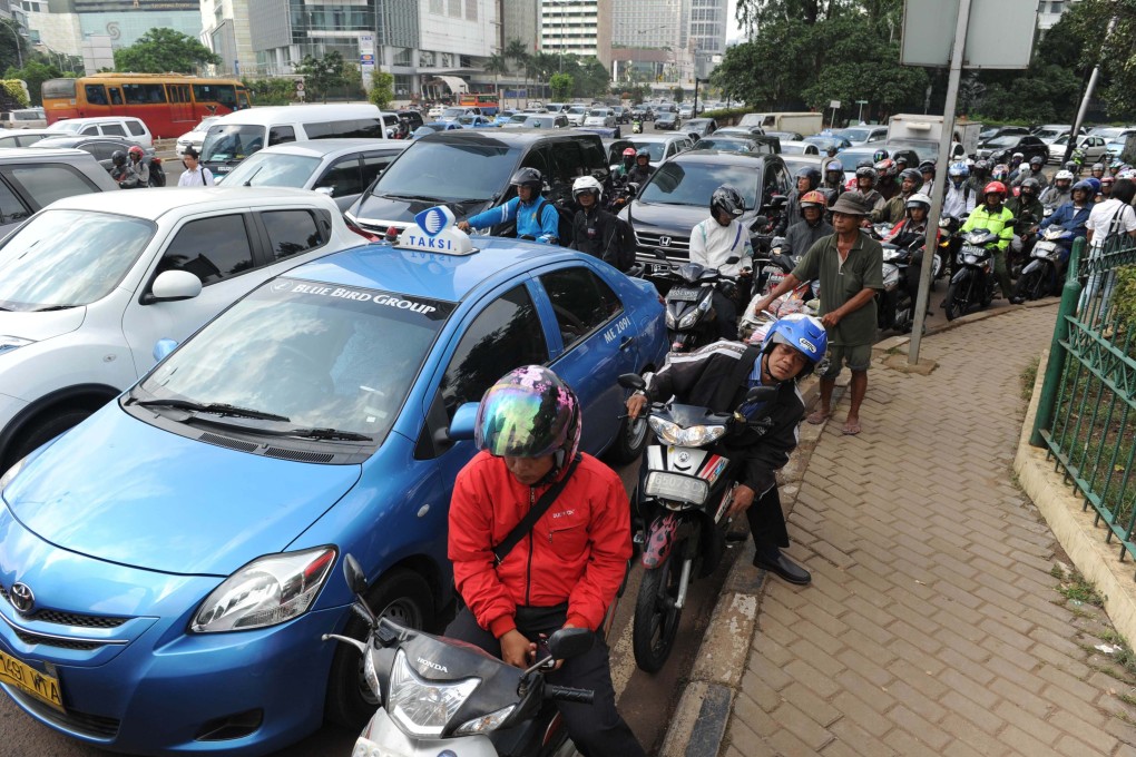 Jakarta’s authorities have ordered civil servants to take public transport on Wednesdays in a bid to reduce the city’s traffic congestion. Photo: AFP