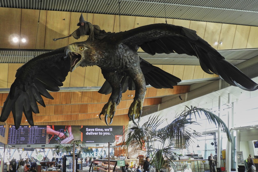 A sculpture of an eagle from “The Hobbit” films, bearing the wizard Gandalf, hangs over the food court area of Wellington Airport on Monday. Photo: AP