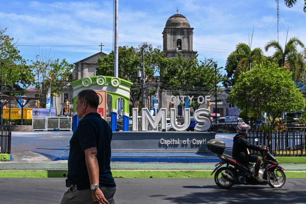 Street signage is seen in front of the Imus Cathedral in the Philippine province of Cavite. Photo: AFP