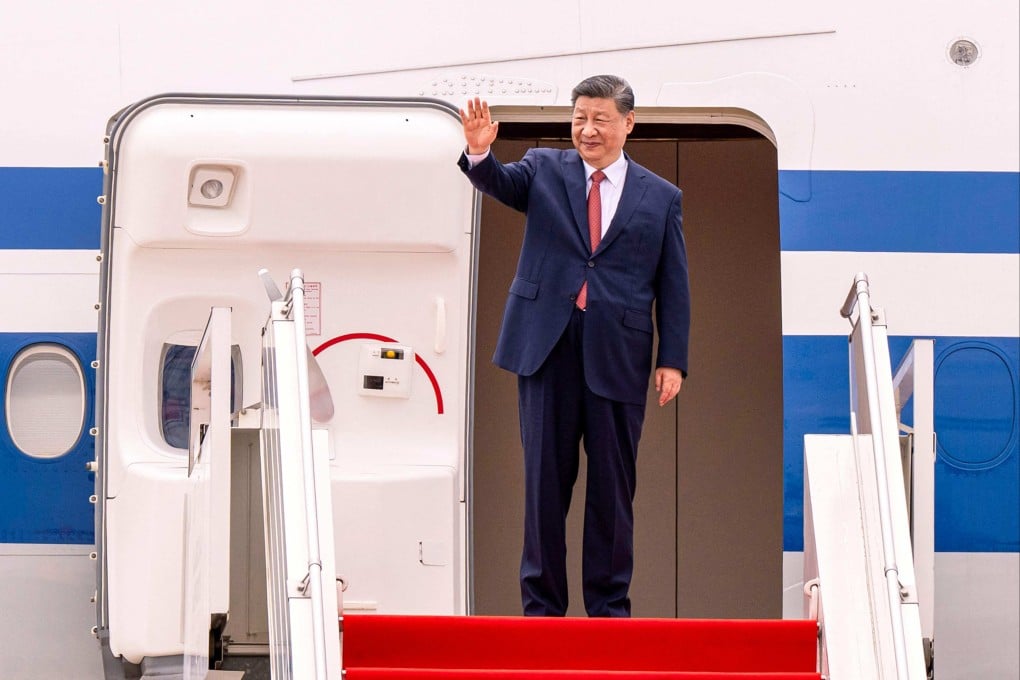 China’s President Xi Jinping waves as he departs from Phnom Penh International Airport on April 18. Photo: Pool/AFP