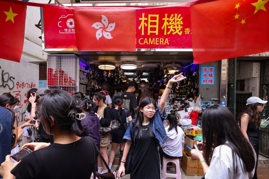 Tourists flock to a second-hand camera shop during the “golden week” holiday. Photo: Nora Tam