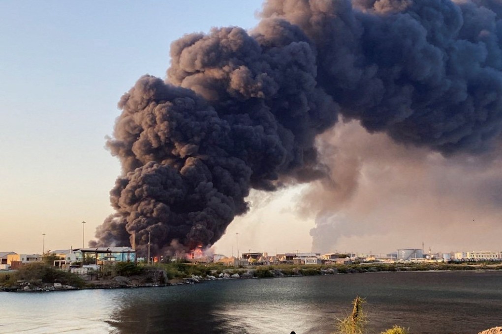 A large plume of smoke rises from a fuel depot in Port Sudan on Tuesday. Photo: Reuters