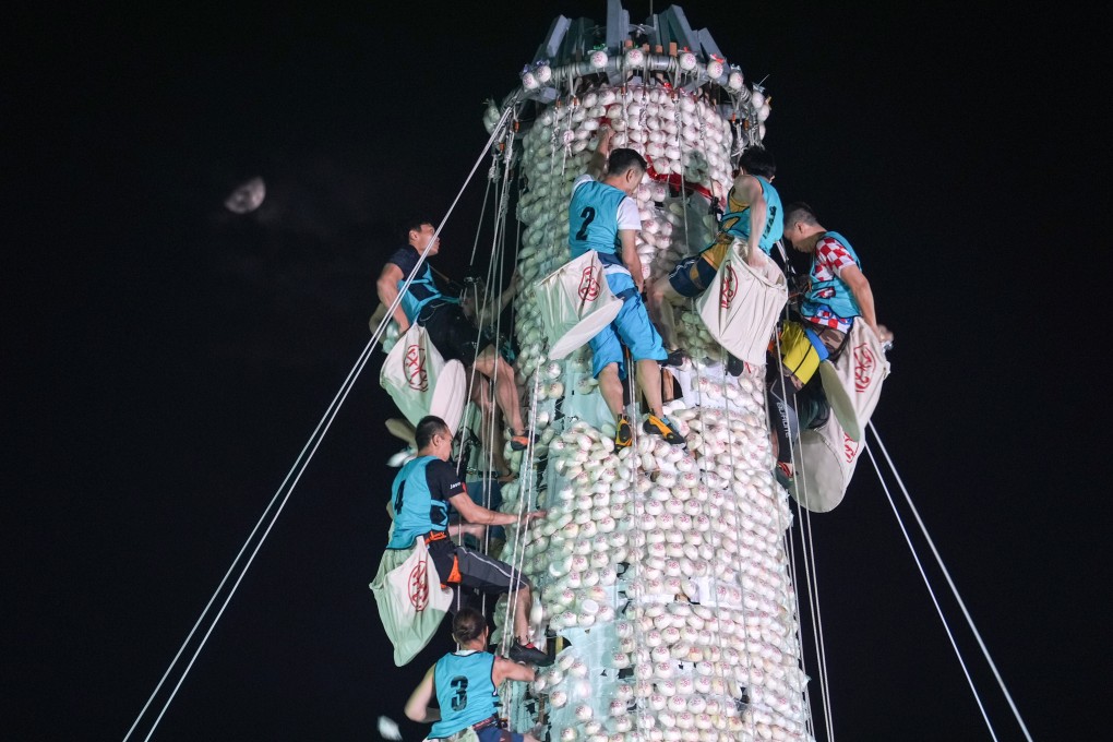 The competition is considered to be the highlight of the annual Cheung Chau Bun Festival, with crowds gathering in the evening of the festival’s fourth day before the contest begins at midnight. Photo: Eugene Lee