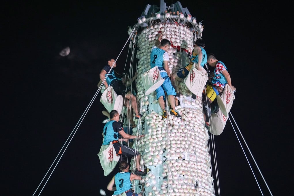 The competition is considered to be the highlight of the annual Cheung Chau Bun Festival, with crowds gathering in the evening of the festival’s fourth day before the contest begins at midnight. Photo: Eugene Lee