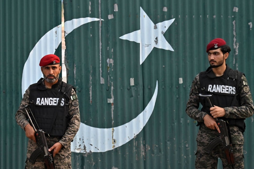 Paramilitary soldiers stand guard outside a government building in Pakistan after Indian strikes in Muridke, about 30km from Lahore on Wednesday. Photo: AFP