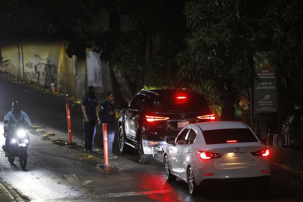 Police at a roadblock on a street leading to Argentina’s embassy in Caracas, Venezuela. Photo: AP