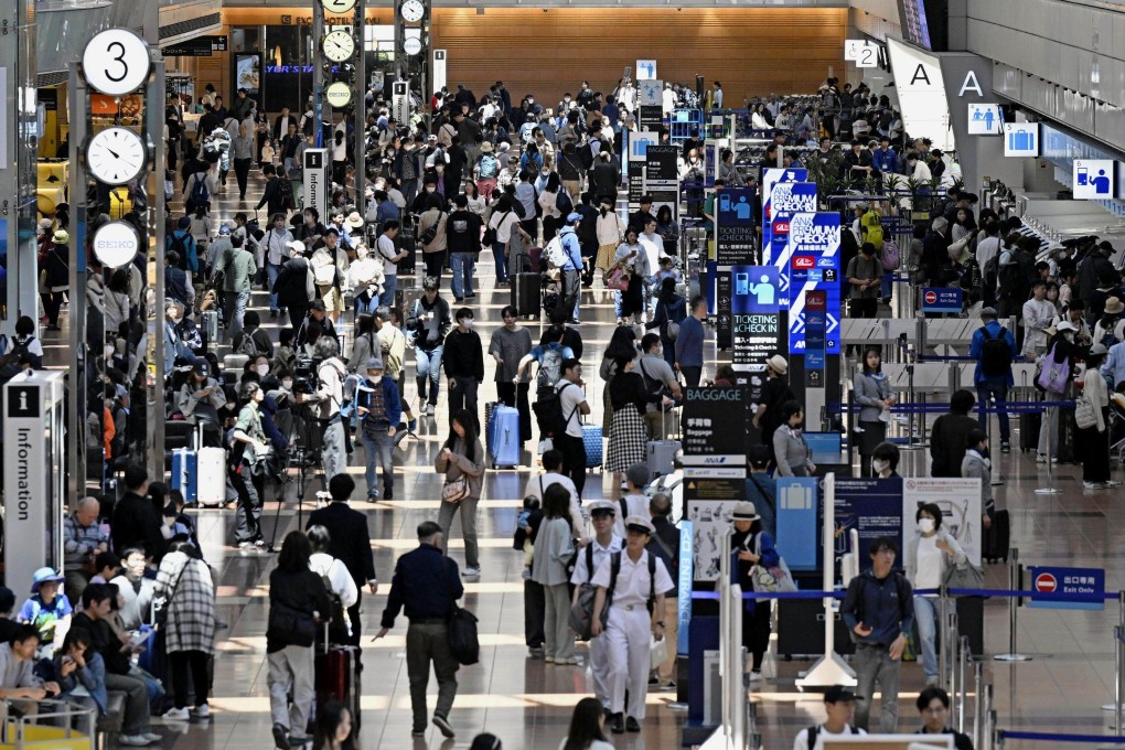 A domestic departure lobby at Tokyo’s Haneda airport is crowded with passengers during the Golden Week holiday season on May 3. Photo: Kyodo