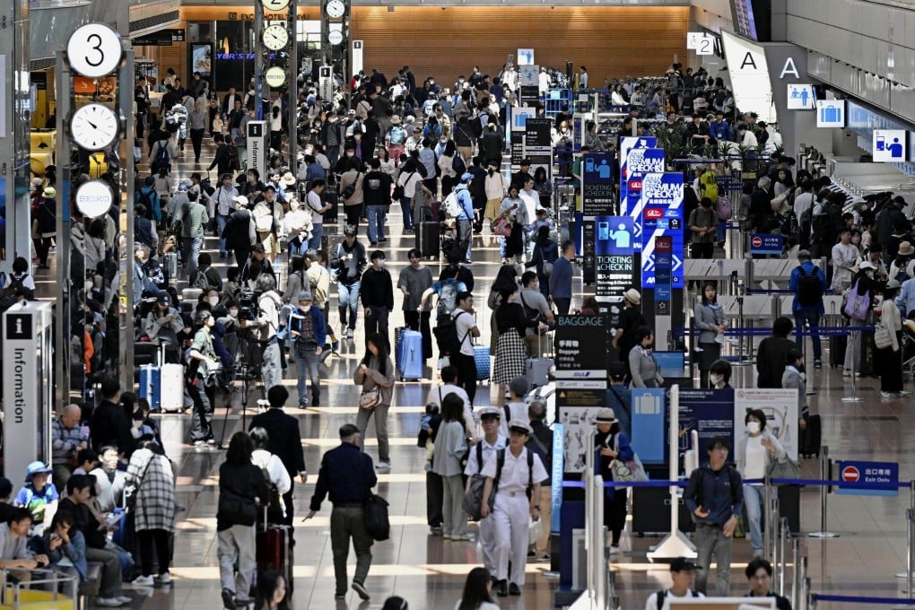 A domestic departure lobby at Tokyo’s Haneda airport is crowded with passengers during the Golden Week holiday season on May 3. Photo: Kyodo