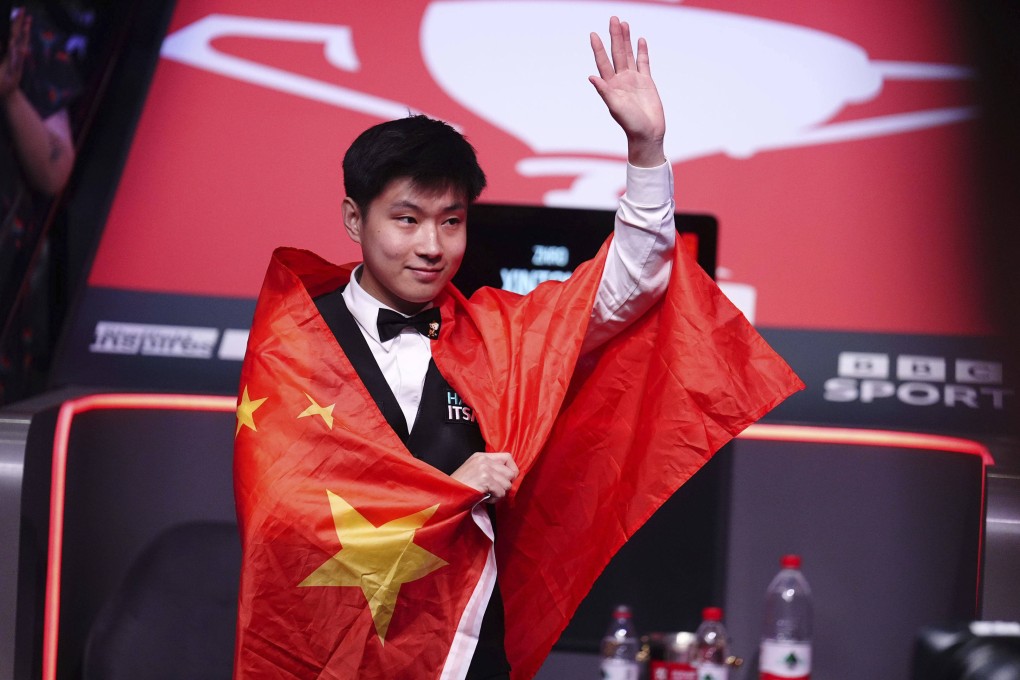 Zhao Xintong celebrates victory in the World Snooker Championship final in Sheffield on Monday. Photo: AP