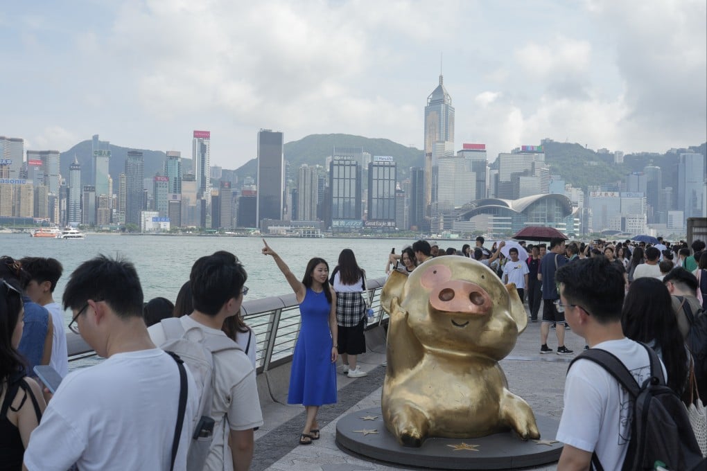 Tourists at the Victoria Harbour waterfront in Tsim Sha Tsui on the fourth day of the Labour Day “golden week” holiday. Photo: Sam Tsang