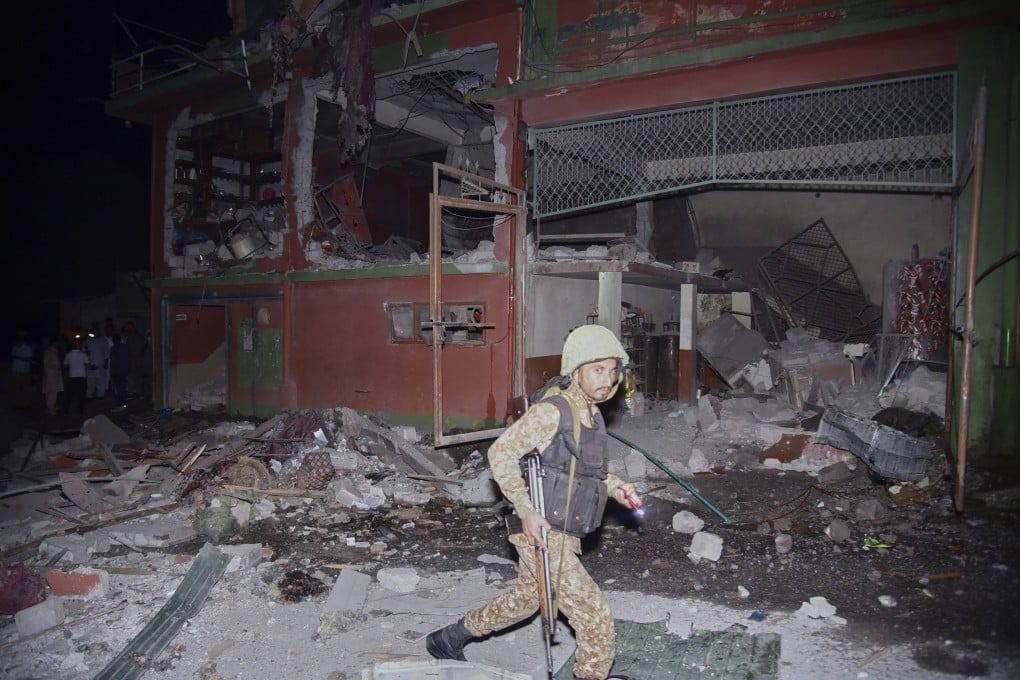A soldier inspects a building damaged by an Indian missile attack near Muzaffarabad, Pakistan-controlled Kashmir, on Wednesday. Photo: AP