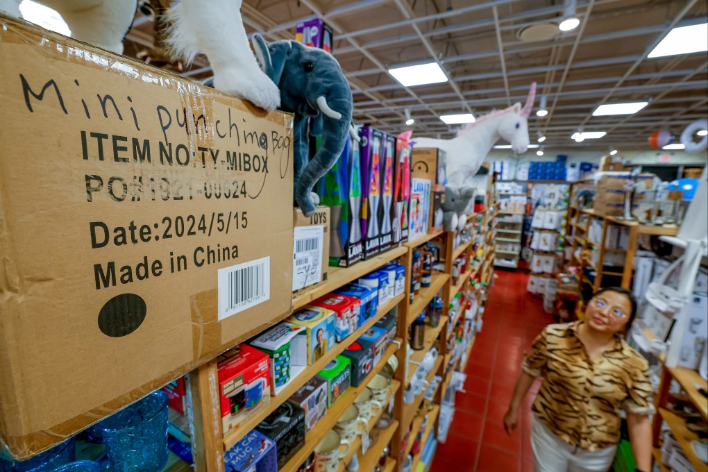 The owner of a store in the US state of Georgia looks at a box of China-made products on Tuesday. Photo: EPA-EFE