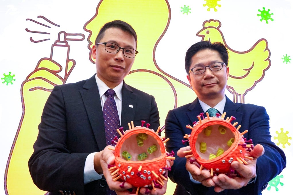 Dr Alex Chin (left) and Professor Leo Poon display virus models as they share a breakthrough in flu development. Photo: Dickson Lee