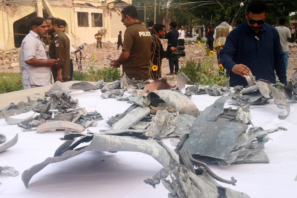 Fragments of Indian missiles are displayed near damaged buildings in Muridke, a town near Lahore, Pakistan, on Wednesday. Photo: Xinhua