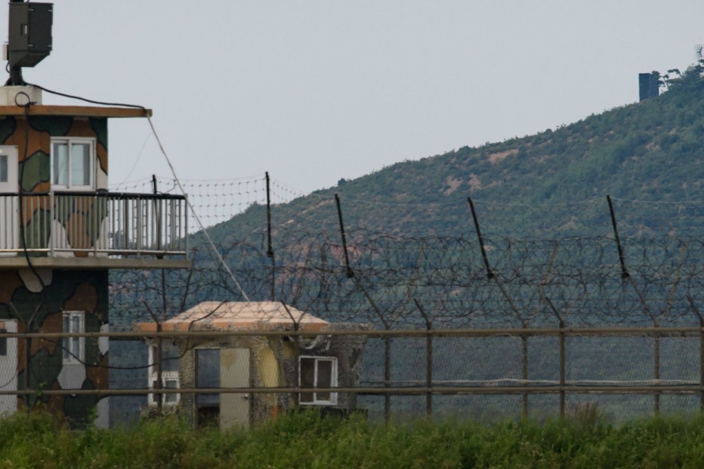 A North Korean propaganda speaker (top) is seen behind a South Korean military guard post (left) seen across the Demilitarised Zone separating the two countries. Photo: AFP
