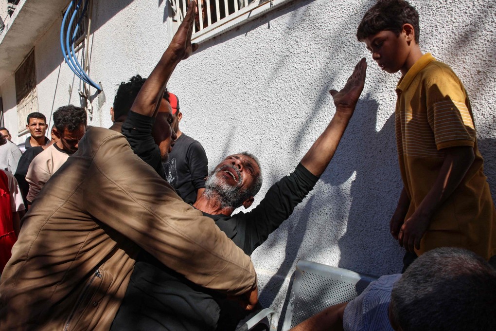 A Palestinian man reacts following an Israeli strike that hit a Thai restaurant and the nearby area in Gaza City on Wednesday. Photo: AFP
