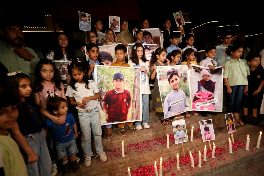 Children attend a candlelight vigil in Peshawar, Pakistan, on Wednesday. Photo: EPA-EFE