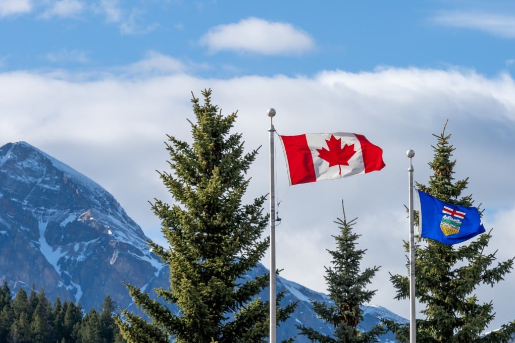 The national flag of Canada and flag of Alberta. Photo: Shutterstock